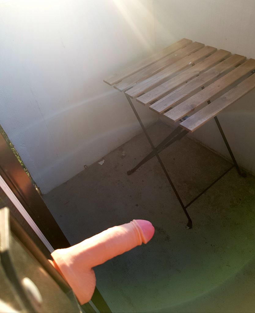 Dildo on balcony